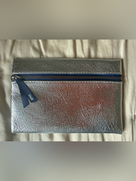 ipsy Handbags - ipsy Metallic Silver Toiletry Pouch with Navy Zipper Pull